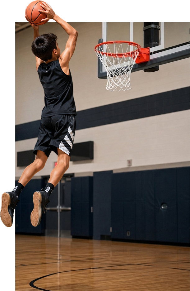Young player jumping to dunk a basketball