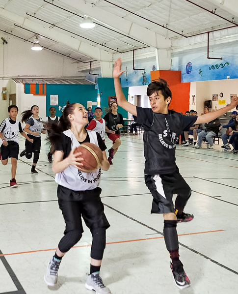 Players in a weekly basketball training session